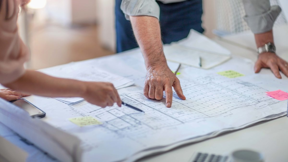 Reviewing site plans and budgets during pre-construction